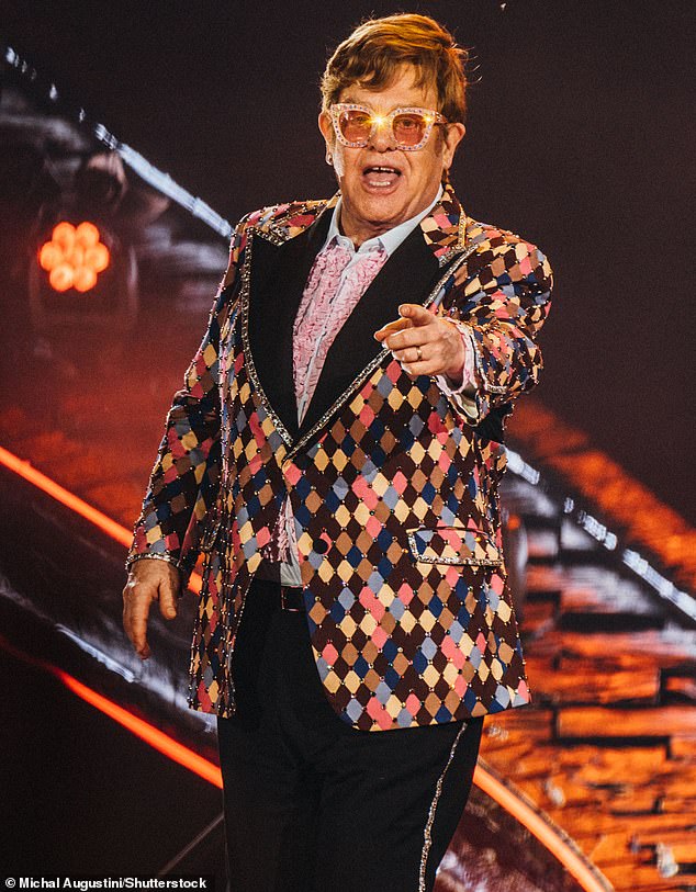 Strange!  The former British Army officer recounted how he arrived 'looking ridiculous' and 'feeling like a jerk' while all the other celebrities 'just turned up like pop stars' (Elton pictured)