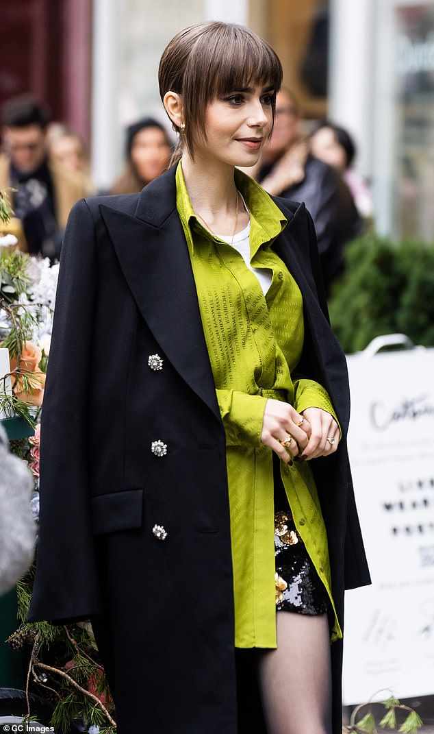 Take a tip from Lily: fancy buttons elevate the feel of a coat.  Change the basic buttons for more elegant closures