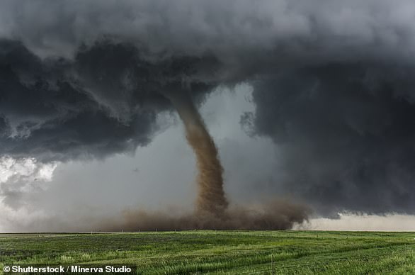 A tornado is a narrow, rapidly rotating column of air around an intense center of low pressure that reaches the ground from cumulonimbus clouds, also known as thunderclouds, according to the Weather Bureau.  In the image, a tornado over a field.