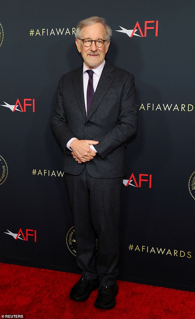 Lavender: The 76-year-old director wore a black suit with a lavender button-down shirt and a dark purple tie for the event