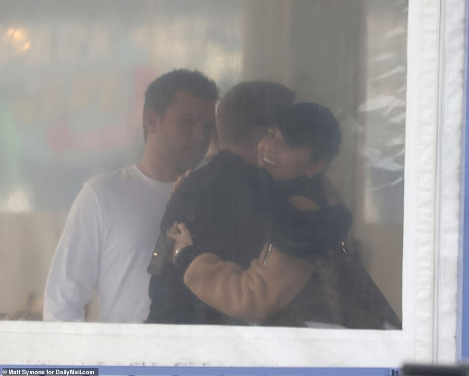 Todd greeted his son Chase's fiancée, Emmy Medders, with a hug and a smile before sitting outside on a canopied deck with the rest of his family.