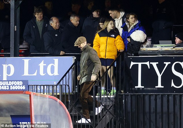 Support system: Her father, former soccer player David, 47, watched in the crowd with her sister Harper, 11.