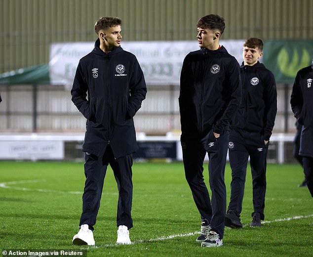 Before the game: Chatted with his new teammates as they circled the pitch before taking on Aston Villa's under-21 side.