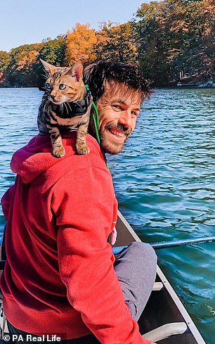 While cats usually won't go anywhere near water, Albert took Mia onto a lake in a rowing boat