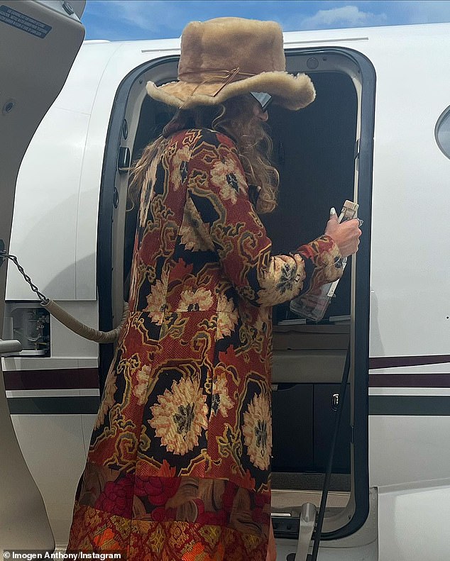 Pictured: Imogen goes retro chic in a long-sleeved 'hippie' jacket for the flight