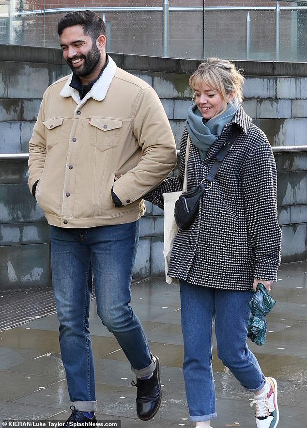 All smiles: The Coronation Street co-stars appeared to be in good spirits as they flashed huge smiles and linked arms during a stroll through Manchester on Thursday