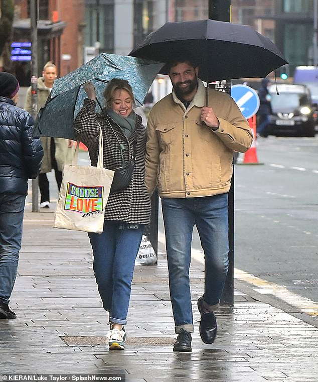 Cosy: The actress, 42, and Charlie, 33, who played couple Toyah Battersby and Imran Habeeb in the ITV soap opera, were seen joking and watching closely during the outing