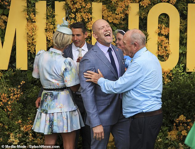 Former rugby ace Mike couldn't contain his laughter as he posed for photos on the day of the Magic Millions race