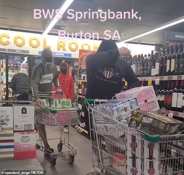 The men tried to protect their faces as they planned to escape from the store.