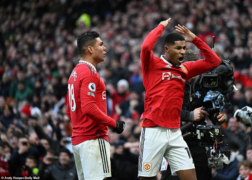 Rashford celebrates after putting United ahead in the game for the first time with eight minutes remaining in regulation.