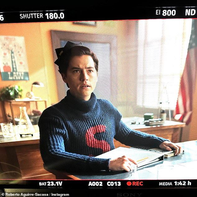 It's happening!  Executive producer Roberto Aguirre-Sacasa shared a photo of Cole Sprouse on a monitor filming a season seven scene wearing a navy blue ribbed sweater with a red S on it.