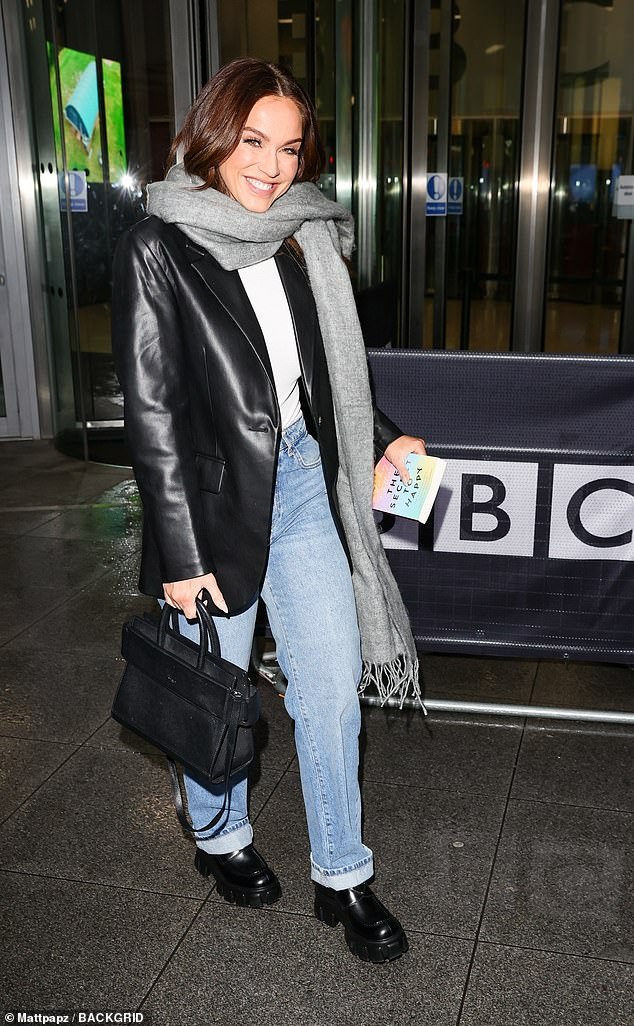 Outfit: Vicky paired a pair of light blue mom jeans with a long-sleeved white boy's suit for the outing, adding chunky loafers to the ensemble.