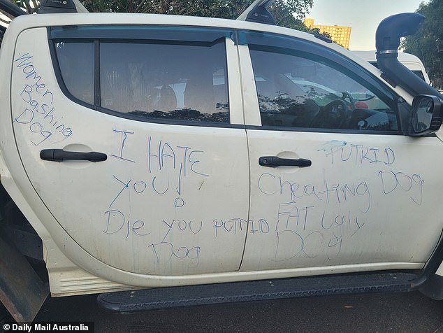 The mystery woman wrote a series of insults on the right side of the car.