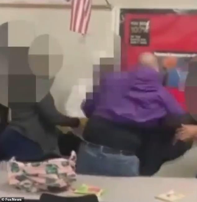 The teacher throws the student to the ground and then climbs on top of him