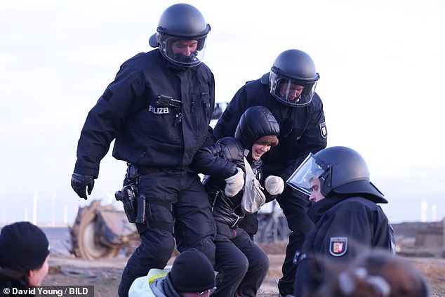 The climate activist laughed when riot police forcefully removed her from a protest against the expansion of a coal mine.