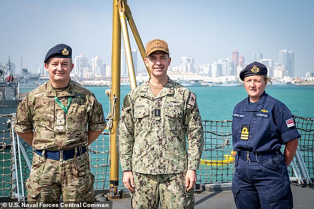 Royal Navy Commodore Adrian Fryer (left) pictured in Bahrain with Vice Admiral Brad Cooper, commander of US Naval Forces Central Command, and Commander Claire Thompson, commanding officer of British frigate HMS Montrose