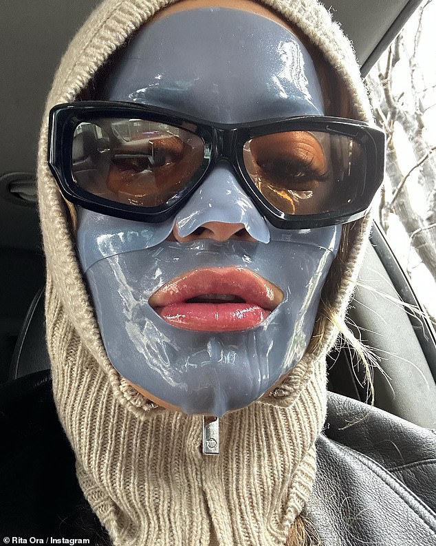 Beauty treatment: Rita Ora looked unrecognizable while sporting a dark blue face mask in a behind-the-scenes moment of her new music video that she shared with fans on Friday