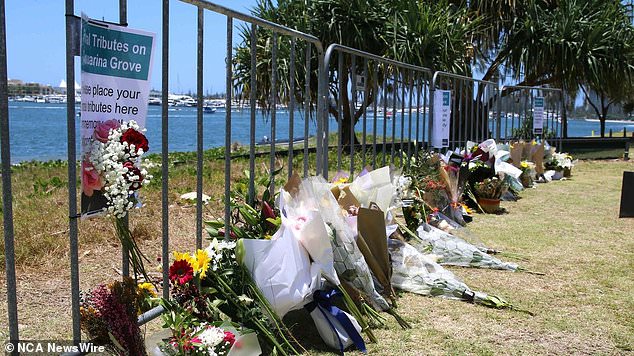 Floral tributes have been laid on the shoreline overlooking the site where four people died in the Sea World Helicopter tragedy on January 2.