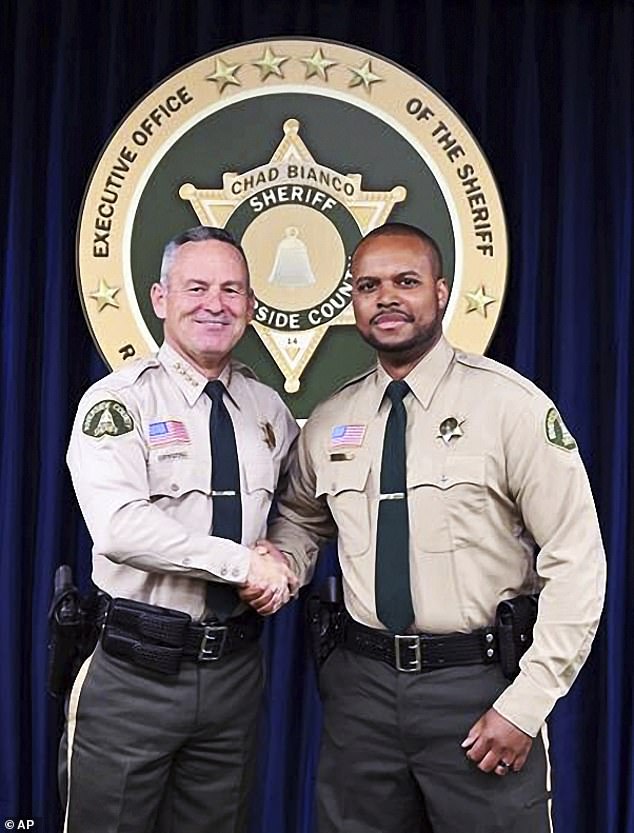 Riverside County Deputy Sheriff Darnell Calhoun, right, poses with Riverside County Sheriff Chad Bianco, left, in Riverside, California.