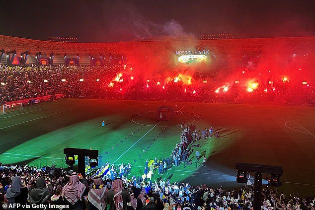 Al-Nassr supporters celebrate Ronaldo's unveiling ceremony at Mrsool Park after his arrival.