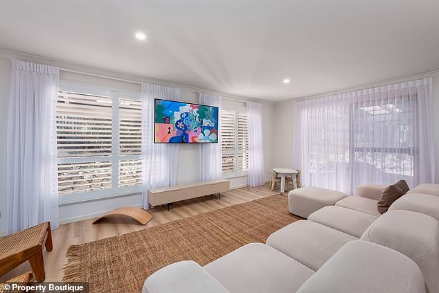 The couple listed their inland Currumbin Valley retreat in October and found a buyer in December, reports Realestate.com.au.  (In the image: the living room)