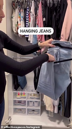 Natasha first folded the jeans vertically, and then hooked a hanger around two belt loops.