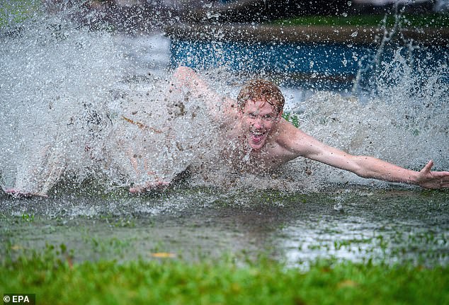 Townsville residents show there is a silver lining to all the rain the region is getting, with the rain set to continue