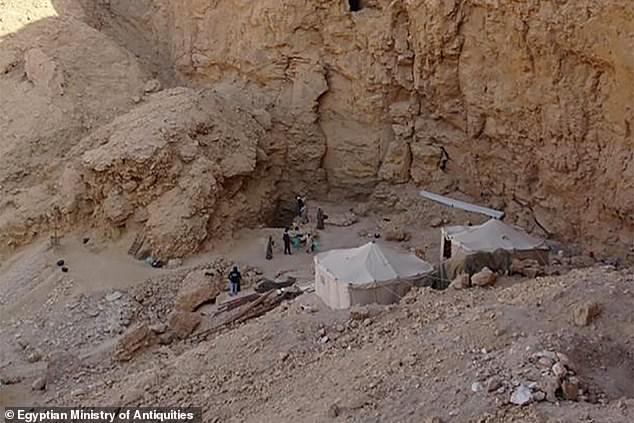 The new tomb, probably that of a royal wife of the 18th dynasty, which features kings such as Akhenaten and Tutankhamun nearly 3,500 years ago, was discovered in Luxor, on the west bank of the Nile. Pictured, a view of archaeologists working on the site