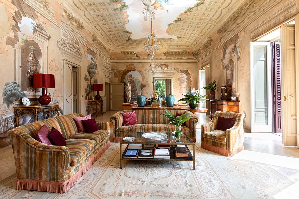 Spacious design: landscape paintings fill the walls and rugs cover the polished stone floors