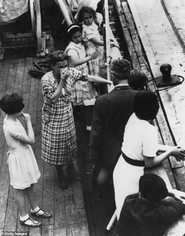 Instead of being let off the ship, nearly all of the 937 passengers, who had obtained tourist visas to stay in the country while waiting for permission to enter the nearby US, were turned away.  Above: Refugees aboard the ship after it was turned away from Cuba