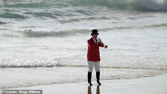 Mike mocked the fanfare of the royal family by including a trumpet herald in royal uniform on an Australian beach.