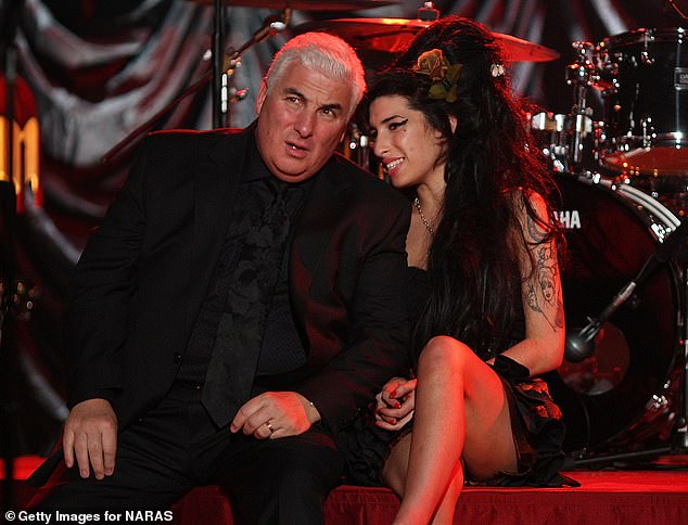 Closing: The new biopic has the full support of Amy's estate.  The singer appears in the photo of her with her father Mitch from her in 2008 at the Grammy Awards presentation, where she won five gongs.