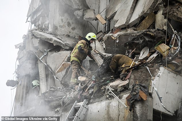 Firefighters in Ukraine seek to rescue woman from rubble after Russian airstrike