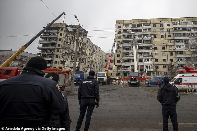 Personnel carry out a search and rescue operation at the site where civilians lost their lives in the missile attack, carried out by Russian forces in the Ukrainian city of Dnipro on Monday.