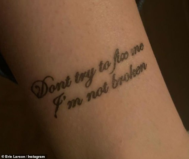 Cheeky: The Oscar-winning actress showed a close-up of an inked that was Evanescence's lyrics and wrote 'How is it like you've never seen temporary tattoos before!'