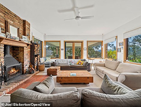 Two fireplaces warm the sunken lounge and family room which opens onto a wrap around terrace and incredible covered outdoor seating area with spectacular views of the surrounding bushland.