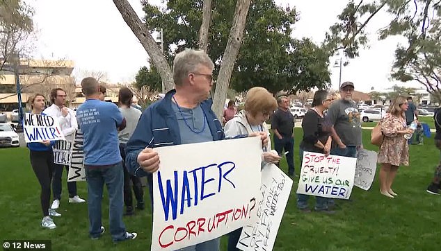 Protesters with families and just a days supply of water gather outside Scottsdale City Hall