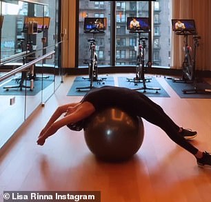 Stretching: Lisa stretched on a balance ball before doing crunches to strengthen her core