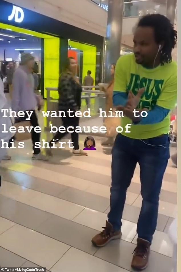 In a clip that has gone viral on social media, the man insists he was peacefully shopping in the shirt, but officers accused him of "religious request"