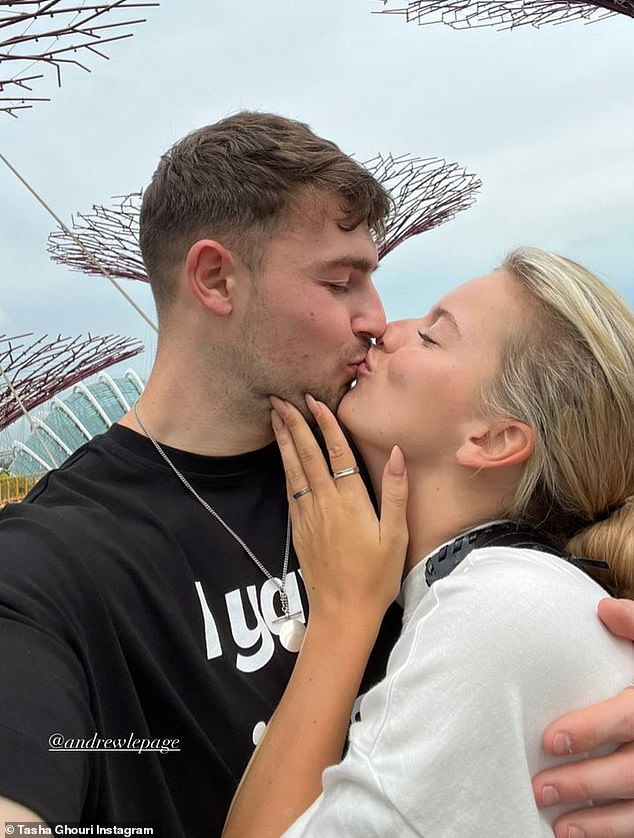 In love: In her Stories, Tasha shared more snaps from the trip, including a sweet image of her kissing Andrew while visiting Singapore's Gardens by the Bay