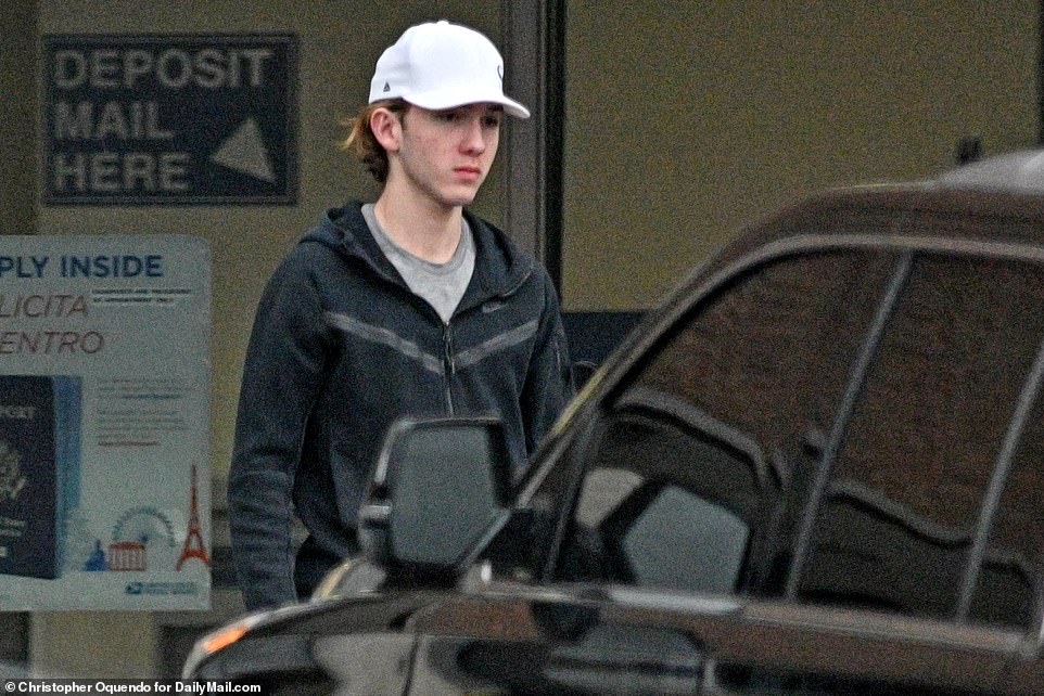 Neither Chrisley cracked a smile on this outing, with 16-year-old Grayson looking somber in a white cap and black tracksuit.