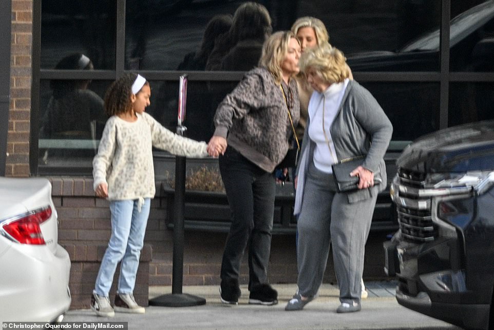 Julie gave her daughter Savannah a kiss as they left the restaurant.  It is one of the last times that she will see her mother before she begins her prison sentence.