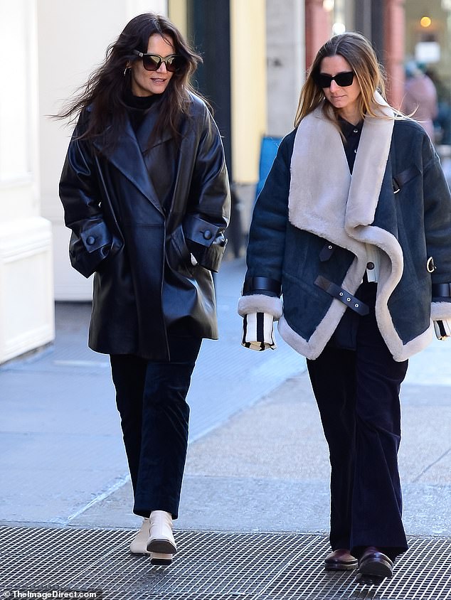 Shearling: Katie's friend, she looked toasty in an oversized blue and white shearling jacket, navy pants, and burgundy shoes.  A long button-down shirt with long blue and white striped cuffs peeked out from under her jacket.