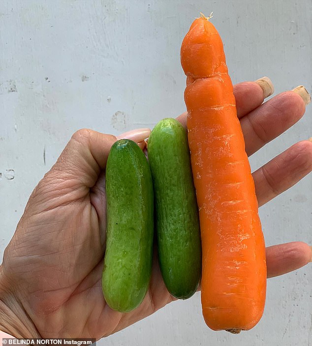 Belinda eats one whole carrot and two cucumbers a day (pictured) because the fiber in carrots helps keep blood sugar levels in check, while cucumbers hydrate the body