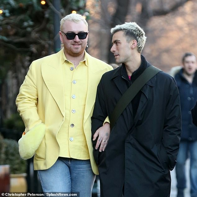 What a pair!  They linked arms with their friend Christian as they enjoyed a walk in SoHo.