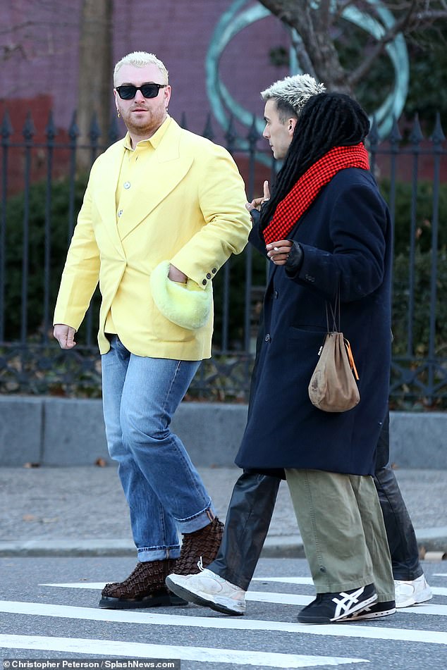 Looking good: Sam accessorized her look with a pair of black sunglasses