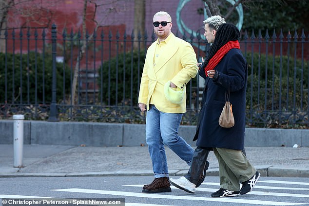 Dressed to impress: Sam's friend completed his look with a pair of white sneakers.