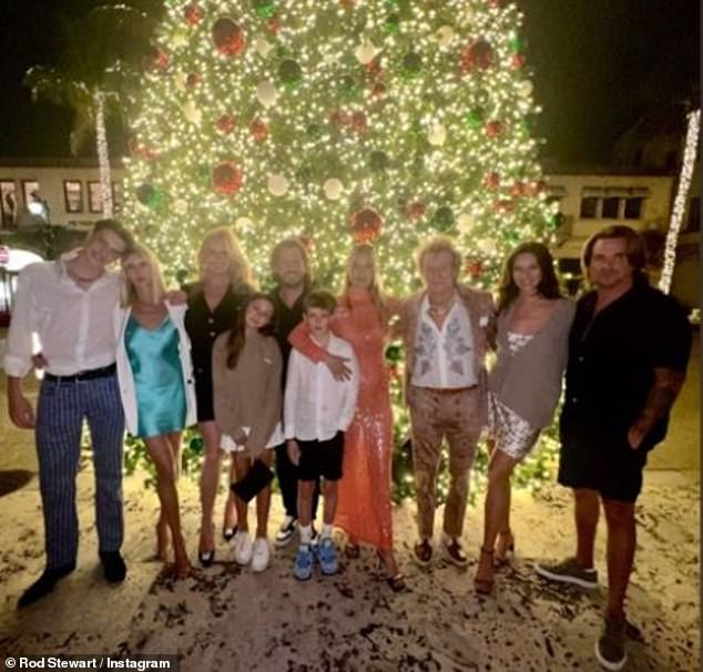 Family: Sir Rod is pictured with some members of his family at Christmas.