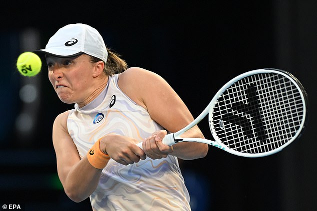 Iga Swiatek of Poland is seen in action against Jule Niemeier of Germany during their first round match at the Australian Open on Monday.