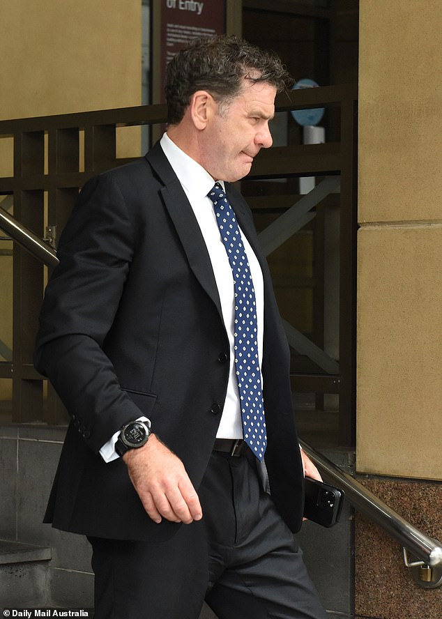 Flash: Detective Inspector Andrew Stamper leaves Melbourne Magistrates Court on Monday